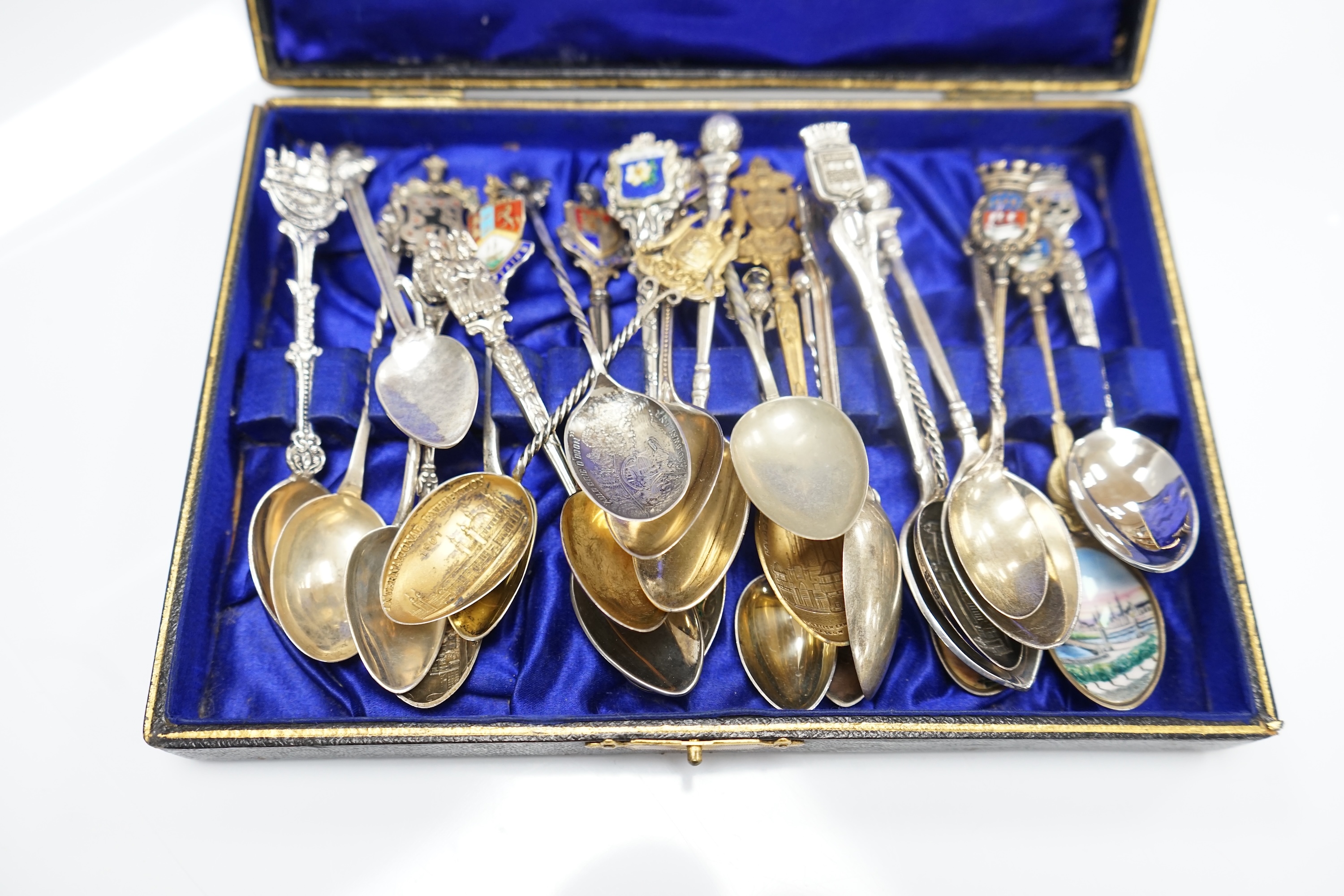 A collection of mainly base metal tie or hat pins and various silver and base metal souvenir spoons and a quantity of assorted 19th century and later silver and other flatware. Condition - poor to fair to good